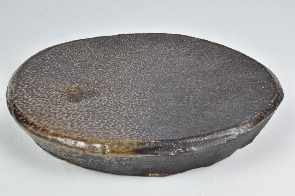 ANNE METTE HJORTSHOJ (born 1973); a salt glazed platter, impressed AMH mark, diameter 25cm. (D)