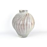 CLAYTON AMEMIYA; a large fluted wood fired stoneware jar, incised CA mark, height 31.5cm.