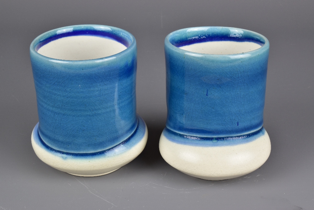 JENI HANSEN GARD; a pair of cups on off centre bases washed in blue glaze, tallest 10.5cm (2). - Image 2 of 6