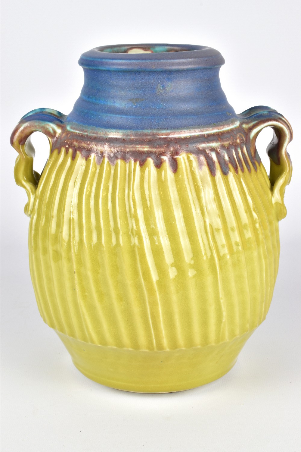 CYNTHIA BRINGLE (born 1939); a fluted porcelain twin handled vase, incised signature, height 23.5cm.