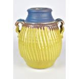 CYNTHIA BRINGLE (born 1939); a fluted porcelain twin handled vase, incised signature, height 23.5cm.