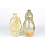 CLAYTON AMEMIYA; a gourd shaped faceted wood fired stoneware bottle and a square bottle, incised