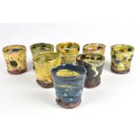 JEAN-NICOLAS GERARD (born 1954); a group of eight small slipware beakers with sgraffito and finger