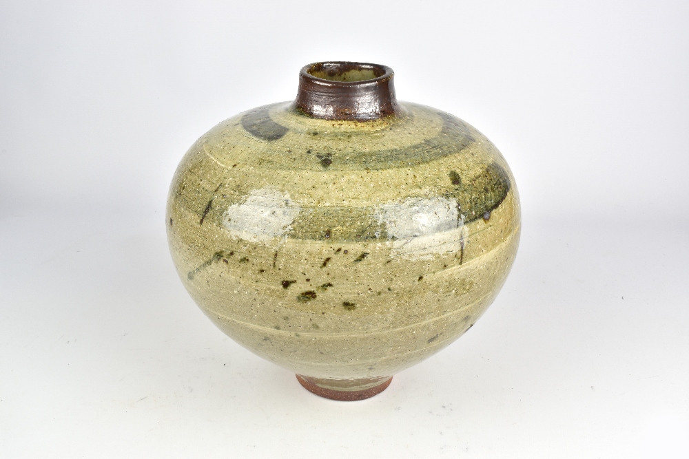 DAVID WRIGHT (born 1947); a squat wood fired stoneware vase covered in ash glaze with brush