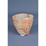 LINDA DE NIL (born 1959); a wood fired porcelain bowl with torn rim, incised mark, height 11cm. (