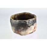 CHUCK HINDES; a raku teabowl, height 7.5cm. Hindes is inspired by Japanese aesthetics and the