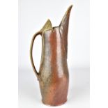 BEDE CLARKE; a wood fired stoneware pitcher, impressed mark, height 36.5cm. Provenance: Purchased