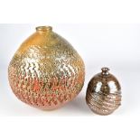 SUSAN GOLD; a globular stoneware vase with textured surface covered in shino glaze and a smaller