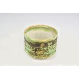 GARY WOOD (born 1955); a stoneware chawan with carved surface, impressed GW mark, diameter 11cm. (D)