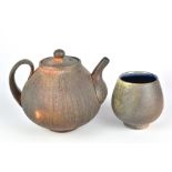 STUART GAIR; a wood fired stoneware teapot with fine sgraffito surface and a teabowl, incised