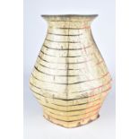 TOM JASZCZAK; an angular earthenware vase with painted linear decoration, height 28cm. Jaszczak is