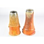 KENYON HANSEN; a near pair of soda and wood fired stoneware tapered vases, tallest 13cm (2).