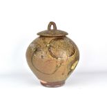 WALLY BIVINS; a large wood fired stoneware jar and cover with carved decorative sweeps, incised