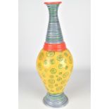 BETSY EVANS; a tall white earthenware bottle with tapered neck, incised colourful decoration,