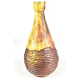 JIM IRVINE; a wood fired stoneware bottle with ribbed body, incised signature, height 26.5cm. Irvine