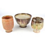 MATTHEW HYLECK; a wood fired stoneware bowl with shino glaze, a matching yunomi and a yunomi covered