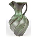 JIM CONNELL; a cut sided jug covered in mottled green glaze, incised signature and dated 2013,