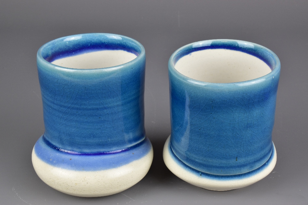 JENI HANSEN GARD; a pair of cups on off centre bases washed in blue glaze, tallest 10.5cm (2). - Image 4 of 6