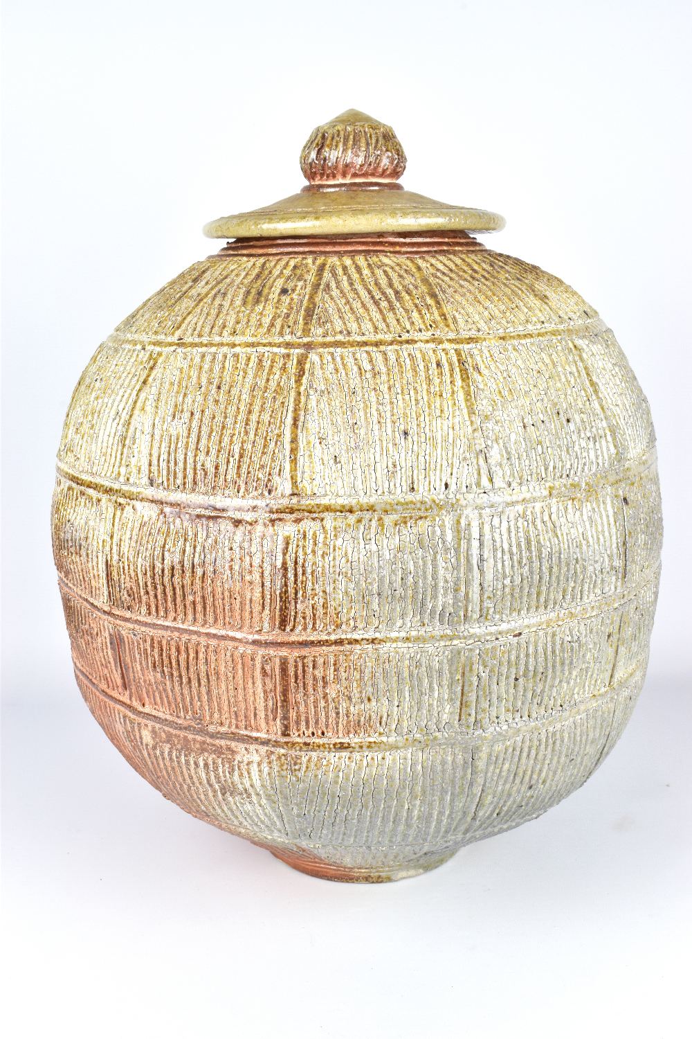 JIM BRASHEAR; a large wood fired stoneware jar and cover with incised and ribbed surface, incised