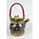 JEAN-NICOLAS GERARD (born 1954); a slipware teapot with willow handle and sgraffito decoration,