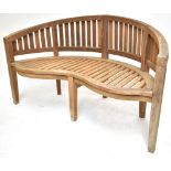 SCANCRAFT; a Danish teak serpentine fronted garden seat, length 151cm. Additional