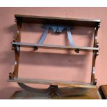 A late Victorian/Edwardian graduated walnut three-tiered open hanging bookshelf, width 69cm.