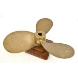 A large early 20th century brass three blade propeller dated 1913 and stamped 'Gaines', now