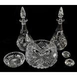 A near pair of clear cut glass decanters with stoppers, the slightly taller height 32cm, a bowl,