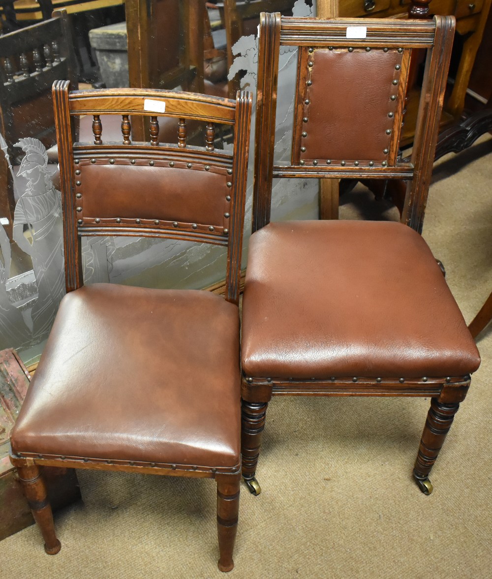 A harlequin set of seven 19th century oak framed dining chairs with leatherette backs and seat