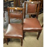 A harlequin set of seven 19th century oak framed dining chairs with leatherette backs and seat
