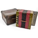 A mid-20th century piano accordion with blind fret detail and mother of pearl keys, in carrying