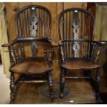 A near pair of late 19th century ash and elm hoop back Windsor elbow chairs with saddle seats and