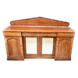 A 19th century mahogany sideboard with arched back, frieze drawers and breakfront central section,