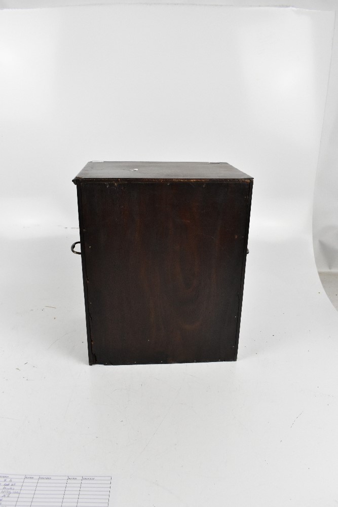 A 19th century mahogany table top cabinet, the single glazed door enclosing two drawers, with swan - Image 3 of 4