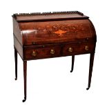 An Edwardian marquetry inlaid cylinder bureau with pierced metal gallery back above domed top