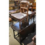 A Victorian mahogany balloon back dining chair with drop-in seat, a further similar example and a