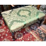 A 19th century rosewood framed footstool with green floral upholstery, length 91cm.  Additional