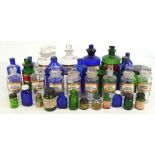 A collection of apothecary bottles including cobalt blue example with dummy stopper bearing label '