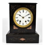 A Victorian slate mantel clock with inlaid marble decoration, the circular enamelled dial set with