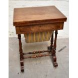 A Victorian burr walnut veneered fold-over games/sewing table, the hinged lid enclosing inlaid chess