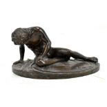 G BRANCA; a 19th century bronze figure of a nude seated soldier, signed to rim, length 19cm.