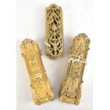 A set of eighteen brass finger plates and a further set of ten pierced brass finger plates.