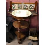 A late Victorian mahogany wash stand with raised tiled back above circular recess set with a bowl