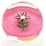PAUL YSART FOR HARLAND; two glass paperweights each internally decorated with single flowers, each