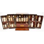 An early 19th century mahogany cased apothecary cabinet, the two hinged doors enclosing further