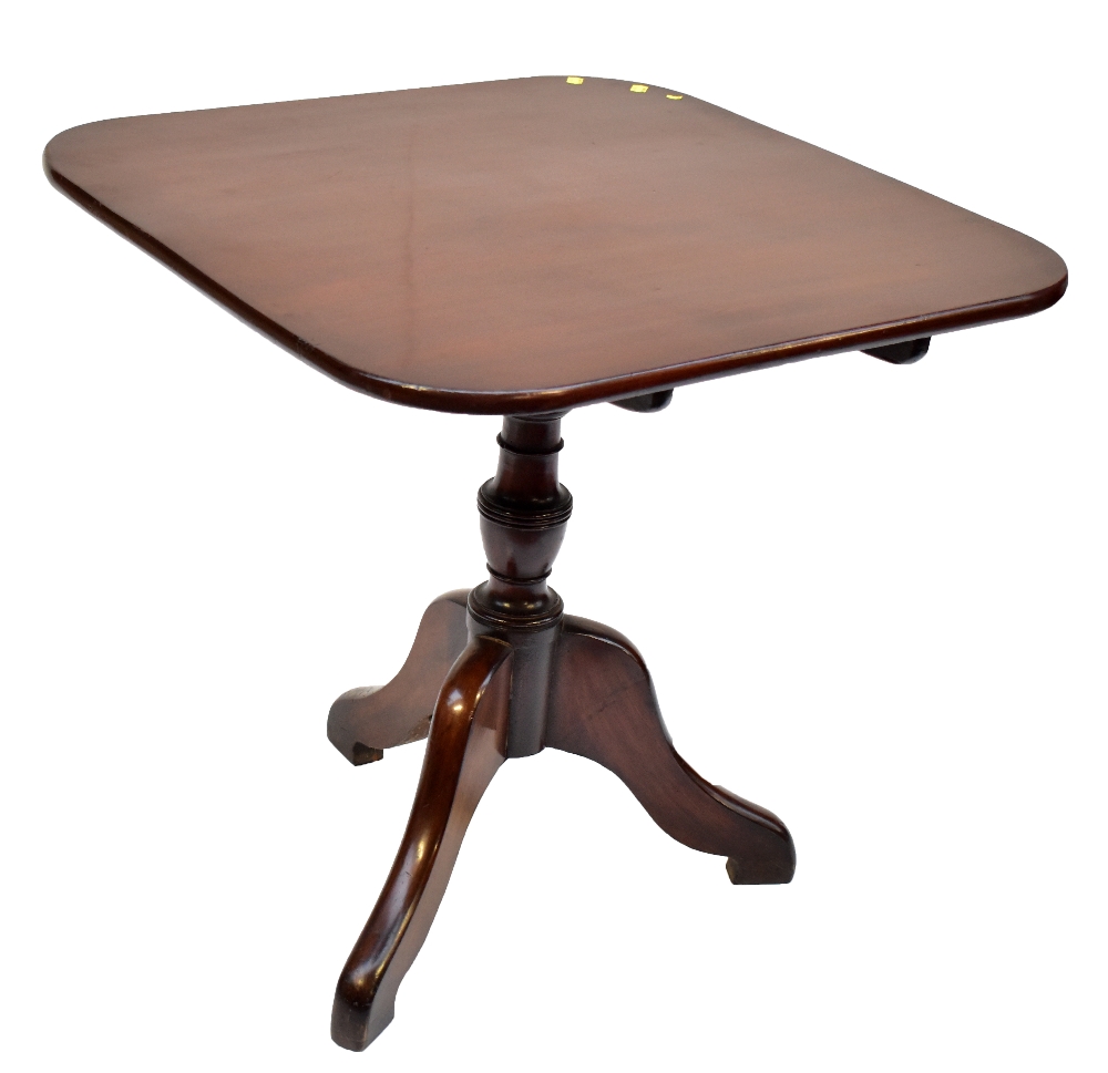 A Georgian mahogany tilt top tripod table raised on outswept supports, height 71cm, top 74.5 x 73.