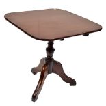 A Georgian mahogany tilt top tripod table raised on outswept supports, height 71cm, top 74.5 x 73.