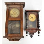 An early 20th century oak cased wall clock, the circular dial set with Roman numerals, length