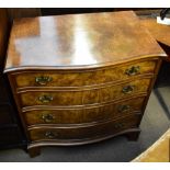 A reproduction burr walnut veneered serpentine front chest of four drawers, raised on bracket