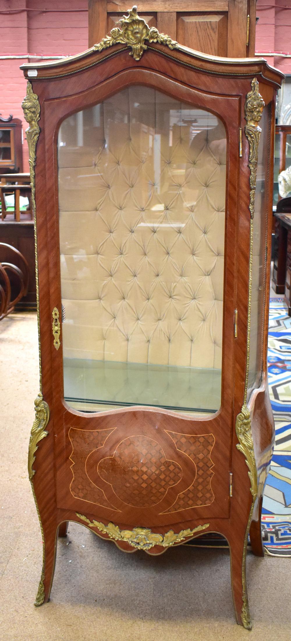 A reproduction French kingwood and marquetry vitrine, the single glazed door enclosing two fixed